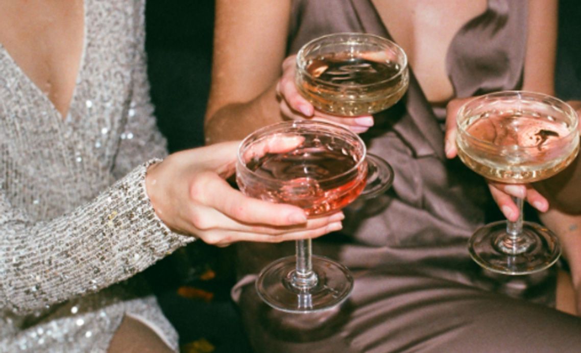 Women raising their glasses for a toast