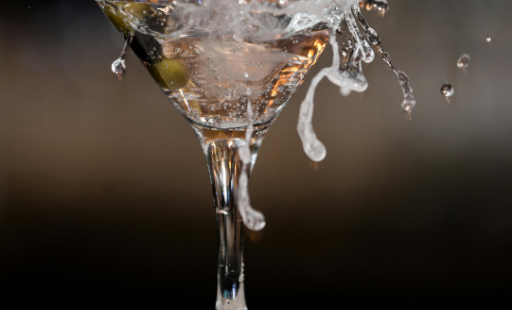 Beautiful martini glass with contents spilling out