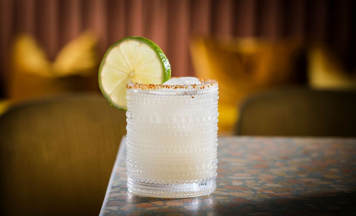 Tequila Cocktail with Lime Garnish